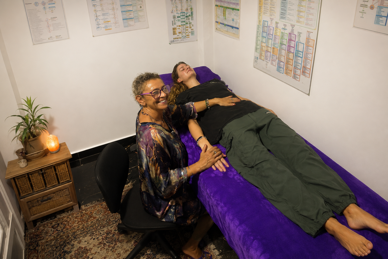 Alison supporting a client in her healing room